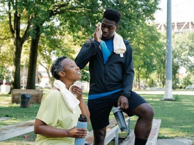 Water bottle and towel on a bench indicating rest